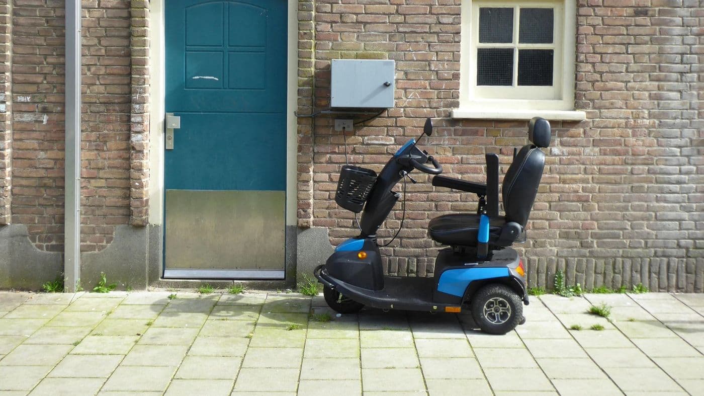 A mobility scooter plugged in to charge