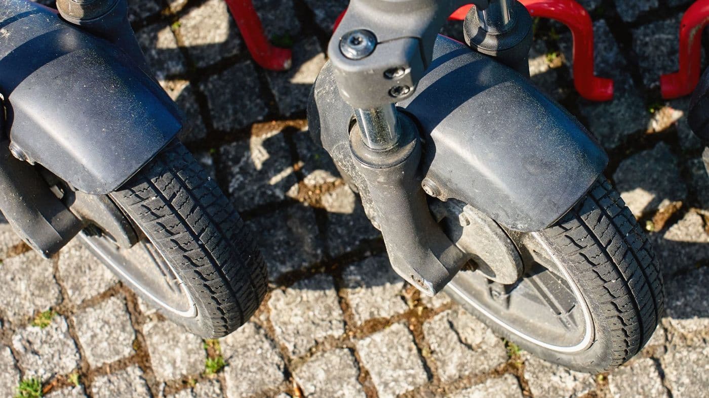 Close-up of the front wheels and tyres of a mobility scooter